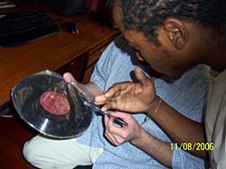 Mhlaba Buthelezi Checks out a rare 1940's 78 RPM Shellac Record