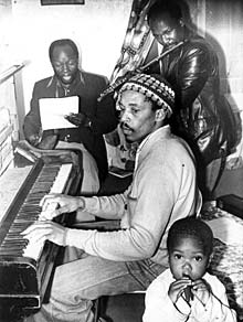 3rd Ear’s Market Café – Zakes Mofekeng, Pat Matshikiza and Tommy Masemola with young Flutist - Rehearsing for Black is The Colour at Dorkay House 1976